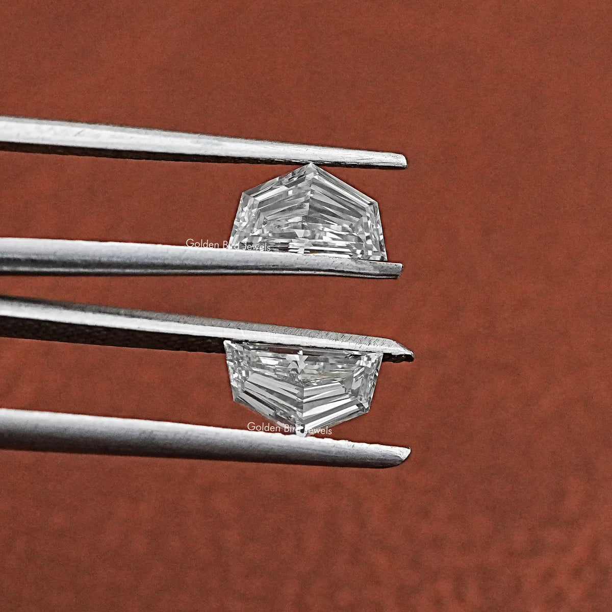 Tweezer holding Cadillac Shaped Lab Grown Matching Pair