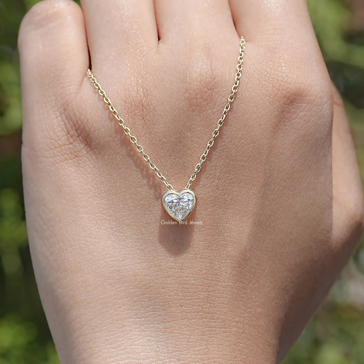 hand Showing View of Heart Cut Lab Diamond Pendant
