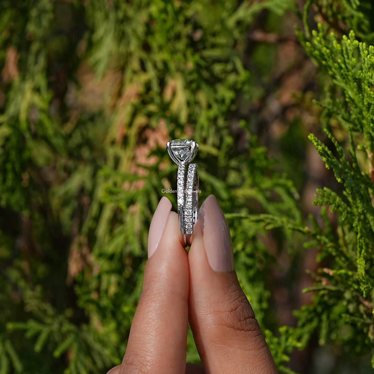 Side View of A Old Round Cut Diamond Ring Set in hold two fingers