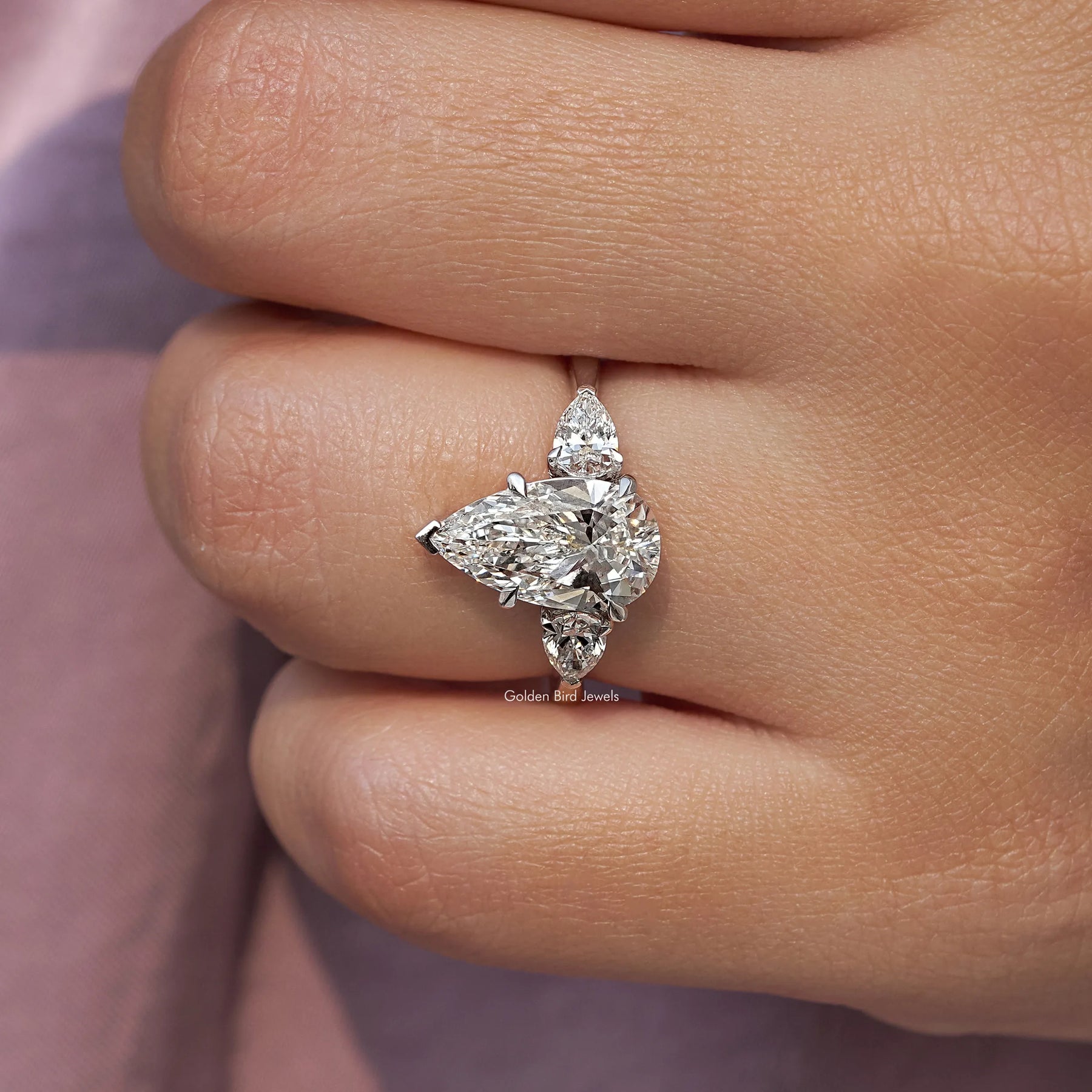 Pear Cut Diamond Engagement Ring In finger