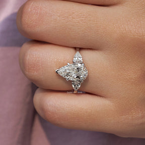 Pear Cut Diamond Engagement Ring In finger