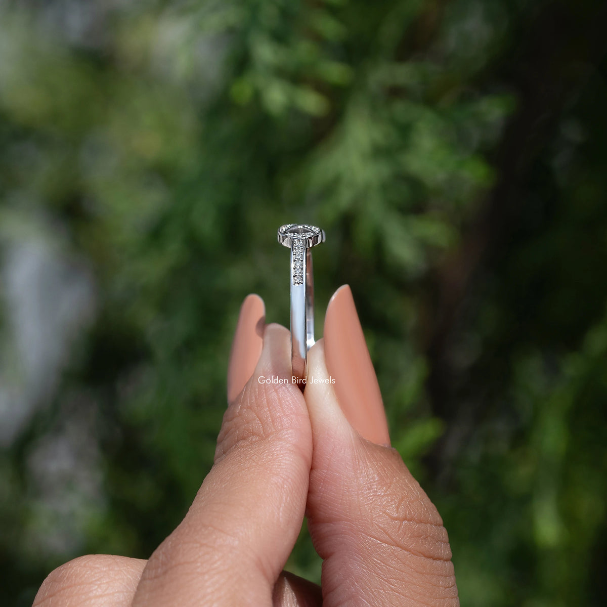 Round-cut stone hope ring with vertical prong-set centerpiece on a silver band