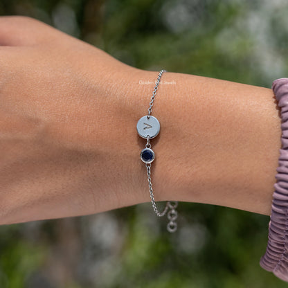 Sterling silver bracelet with letter A charm and round blue gemstone
