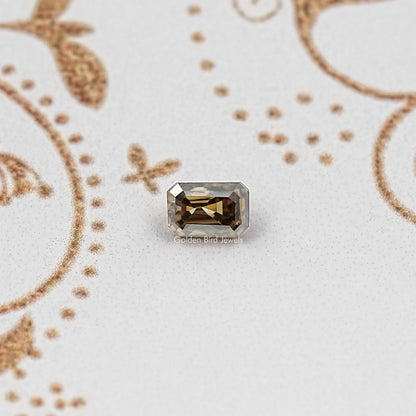 Emerald-cut moissanite loose stone, dark smoky rectangle with facets
