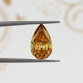 In Tweezer View Of Old Mine Pear Cut Loose Moissanite Stone