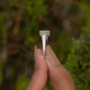 Criss And Trapezoid Cut Three Stone Engagement Ring