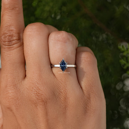Blue marquise-cut center stone ring on slim silver band