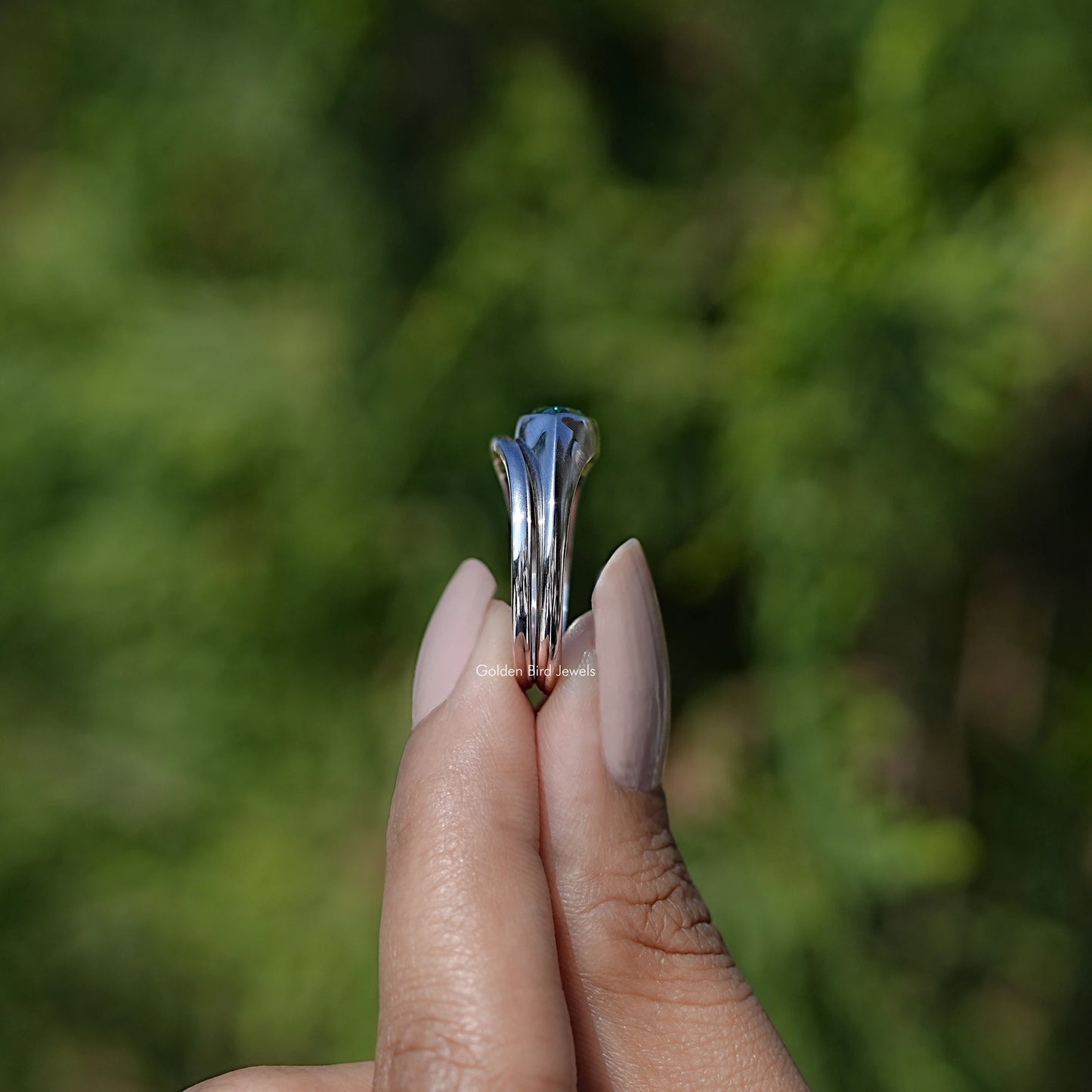 Side View of East West Green Marquise Bezel Set Moissanite Ring Set