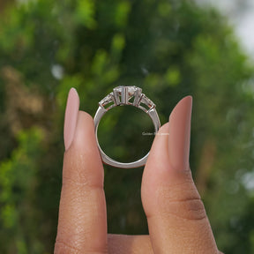 Back View of Pear Cut Diamond Engagement Ring In two fingers
