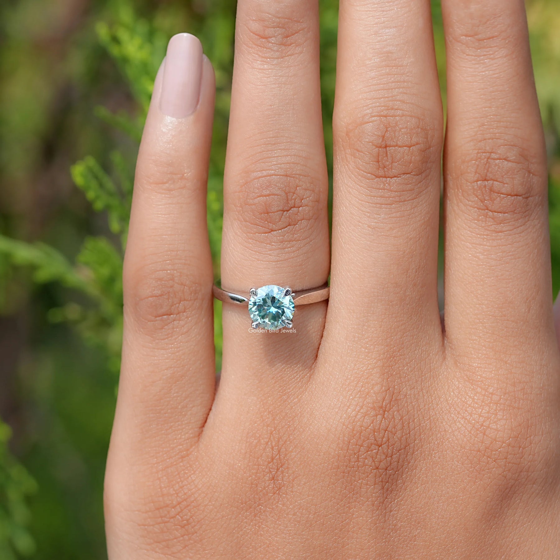 View of  Blue Green Round moissanite Solitaire Ring 
