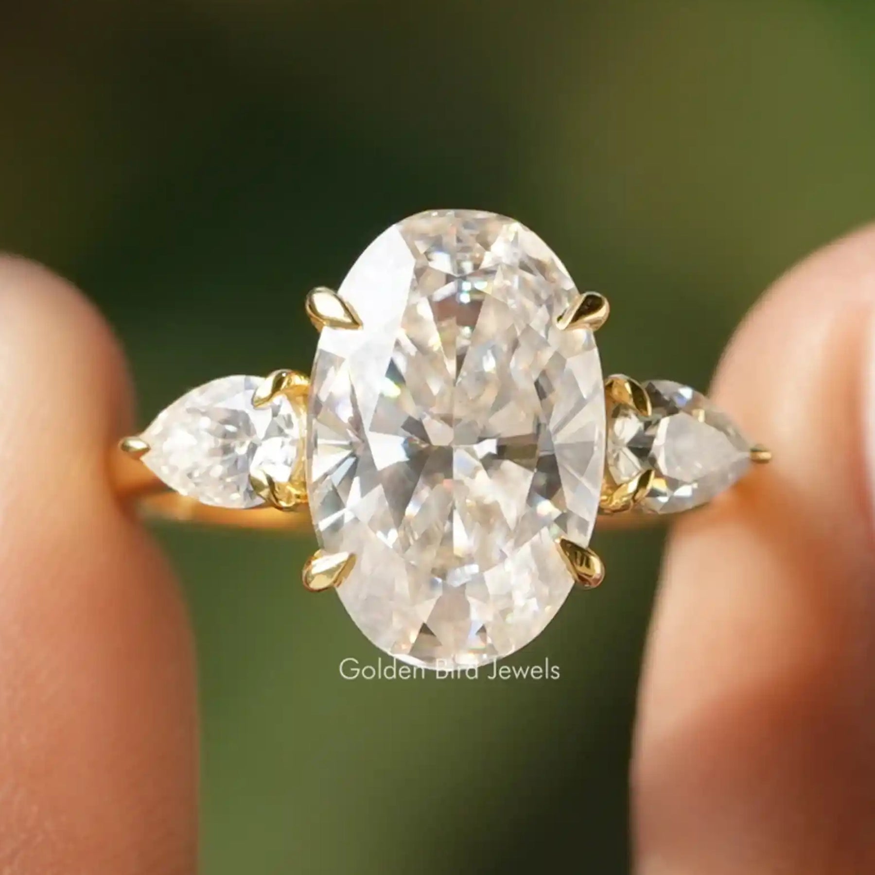 Oval And Pear Cut Moissanite Three Stone Ring