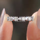 Round Moissanite Distance Eternity Band