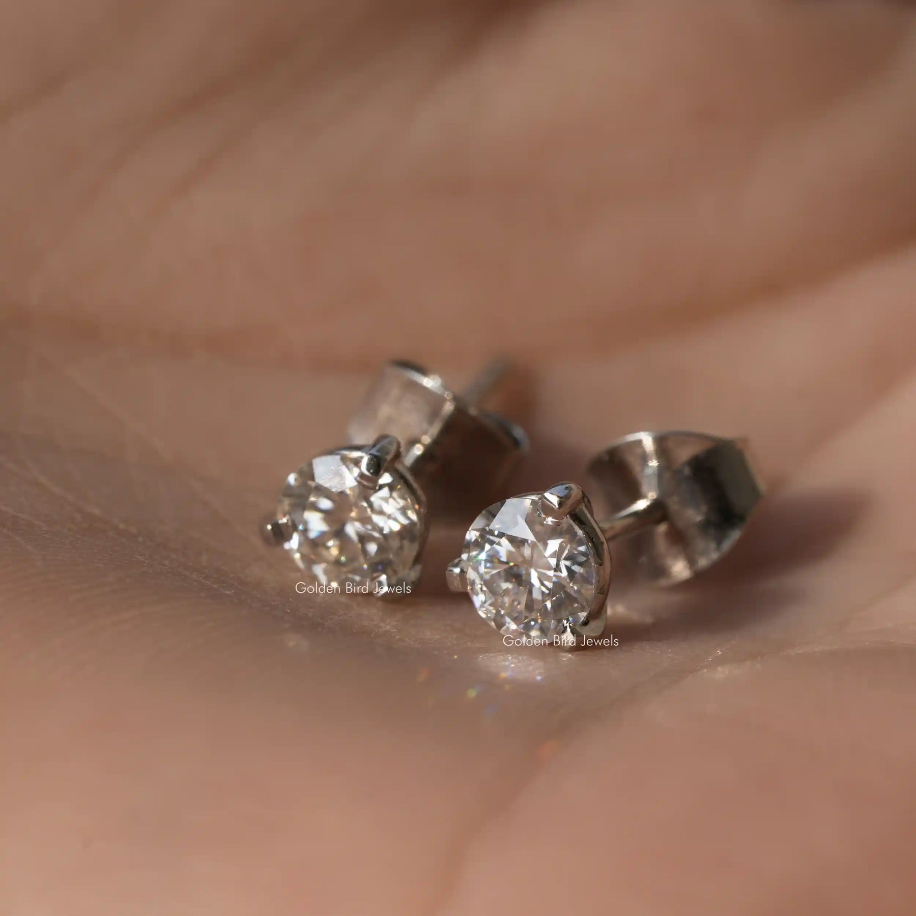 Front view of round cut moissanite earrings  