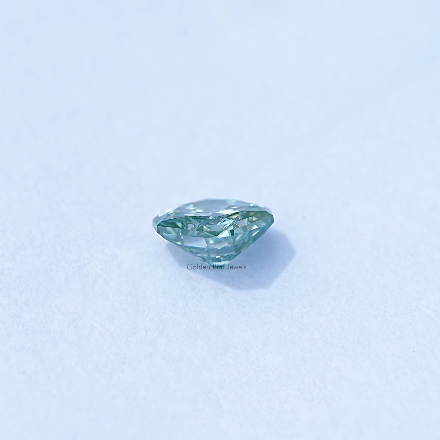 Side view of Green Radiant Cut Loose Stone