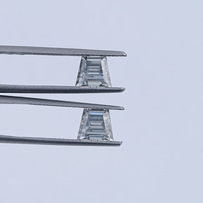 In Tweezer View Of Grey Trapezoid Cut Moissanite Loose Pair
