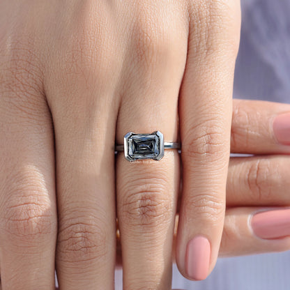 Moissanite solitaire ring with half bezel setting, square-cut stone on sterling silver band