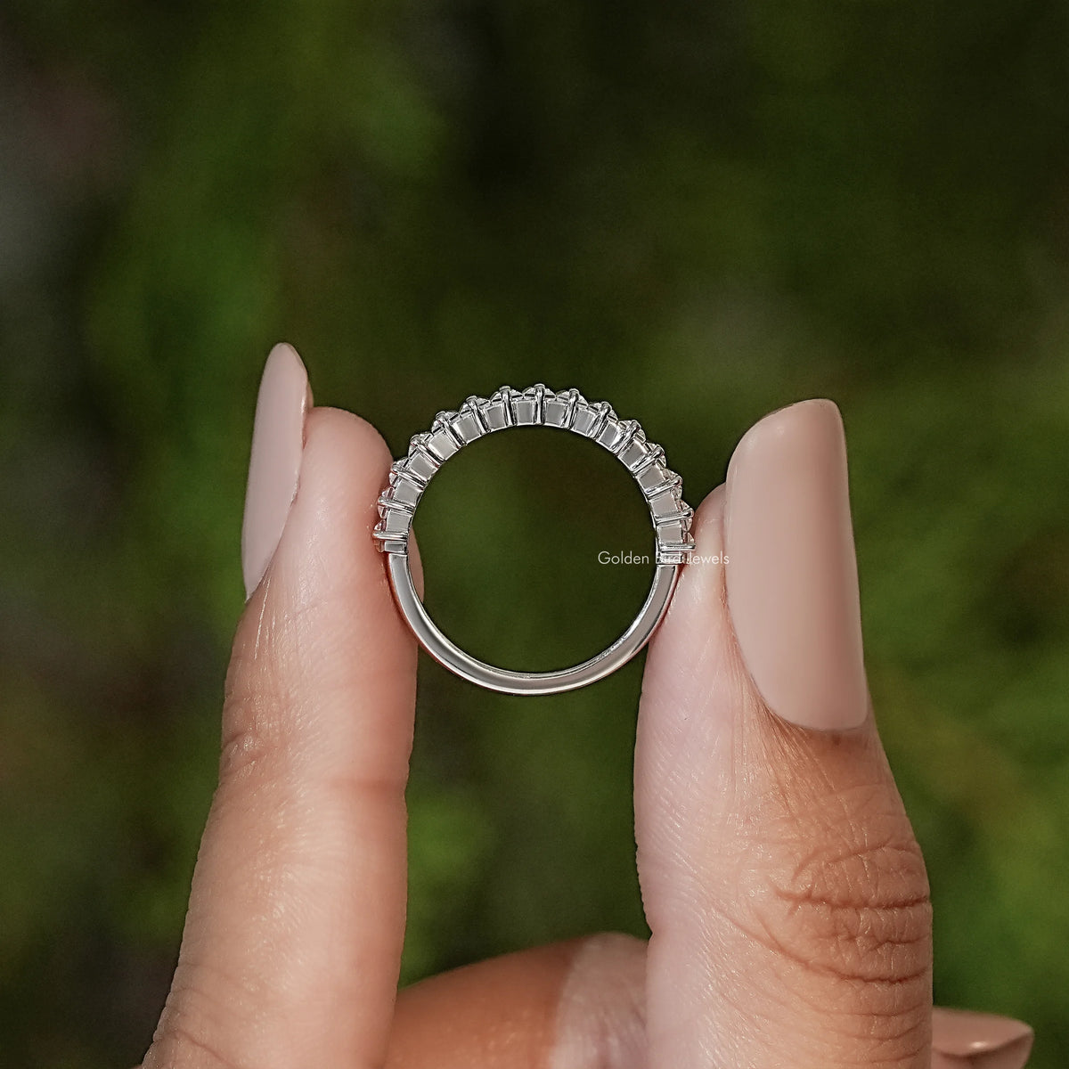Silver baguette-cut half-eternity ring, side view showing rounded top setting
