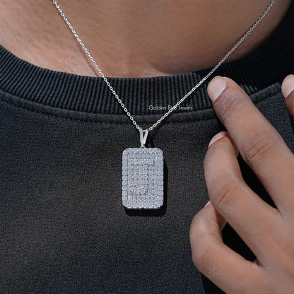 Square lab diamond pendant on silver chain, close-up on neckline