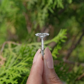 Side View of Marquise Cut Solitaire Diamond Ring In two fingers