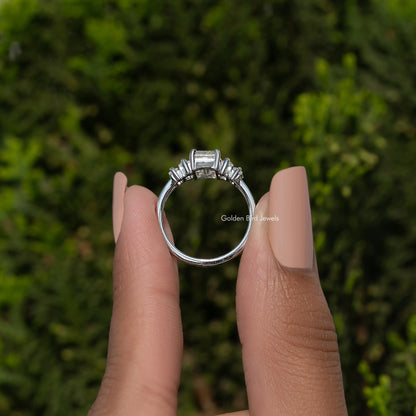 Five-stone split shank ring from above with rectangular emerald-cut stones, silver tone