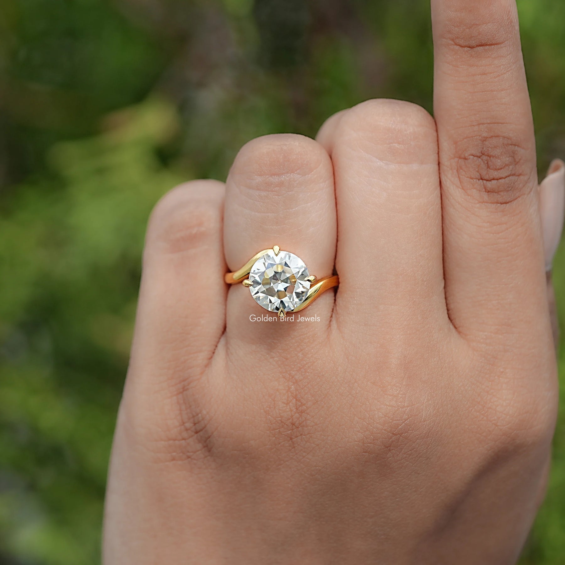 In finger view of Round Cut Solitaire Engagement Ring 