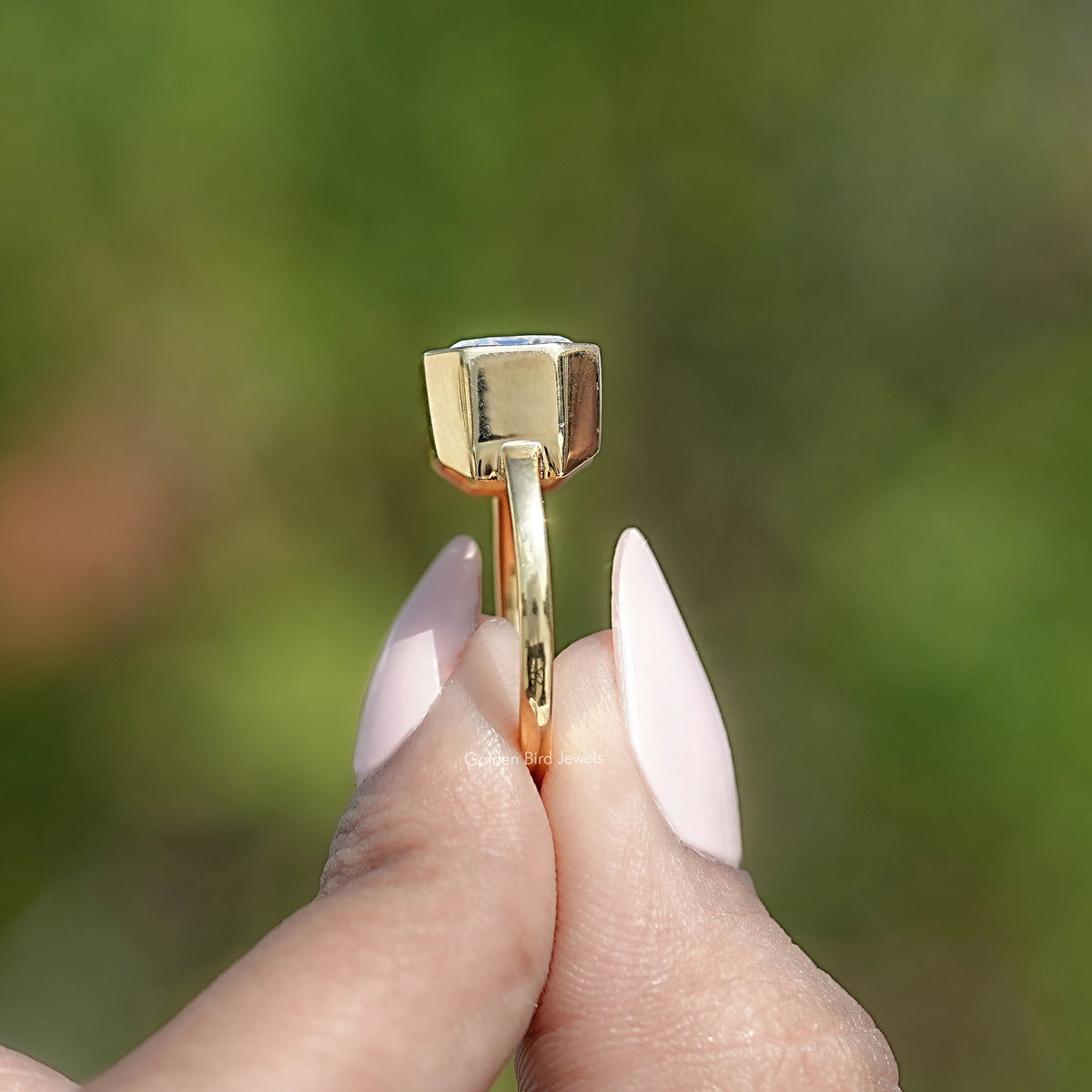 Side View Of East West Emerald Cut Ring