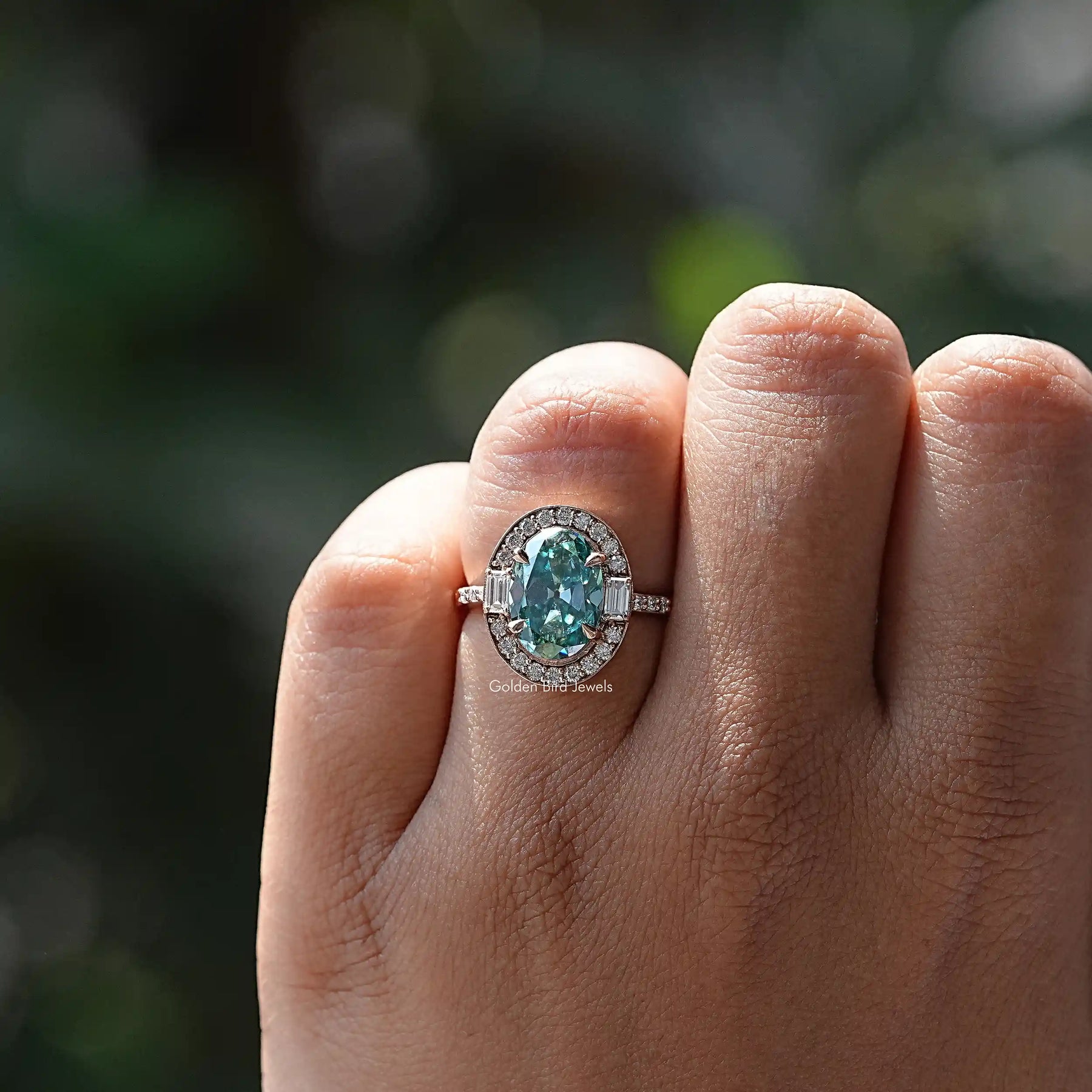 Close-Up View of Oval Cut Moissanite Halo Ring In Yellow Gold        