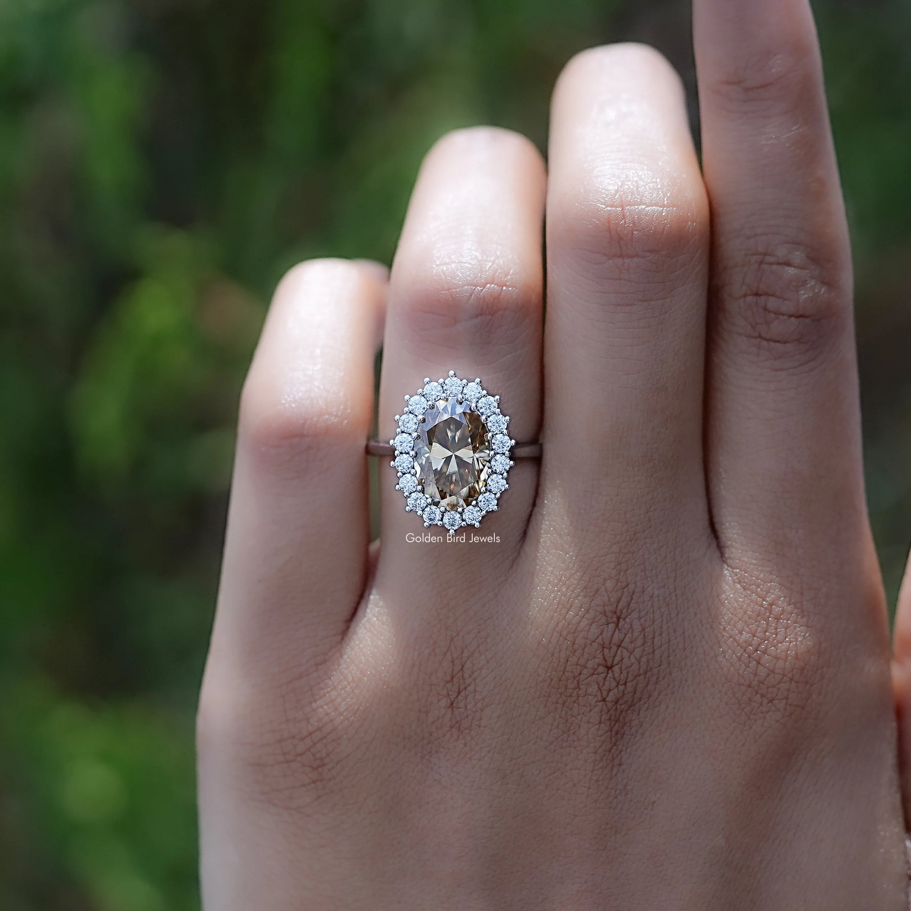 In finger view of Oval Cut Moissanite Engagement Ring
