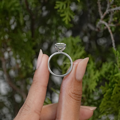 Sterling silver solitaire ring shown from the side, with a raised rectangular center stone and smooth band