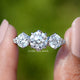 Old European Round Cut Lab Diamond Five Stone Ring held between fingers 