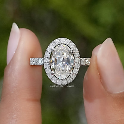 Oval cut moissanite halo solitaire ring in sterling silver