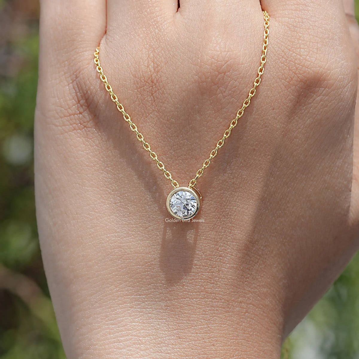 hand Showing View of Cut Round Cut Lab Diamond Pendant
