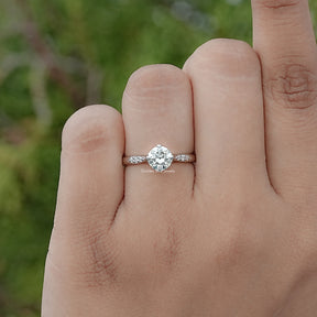 In finger view of Round Cut Moissanite Engagement Ring