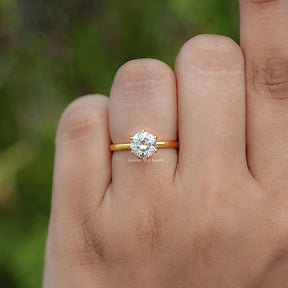 In finger view of Round Cut Moissanite Engagement Ring