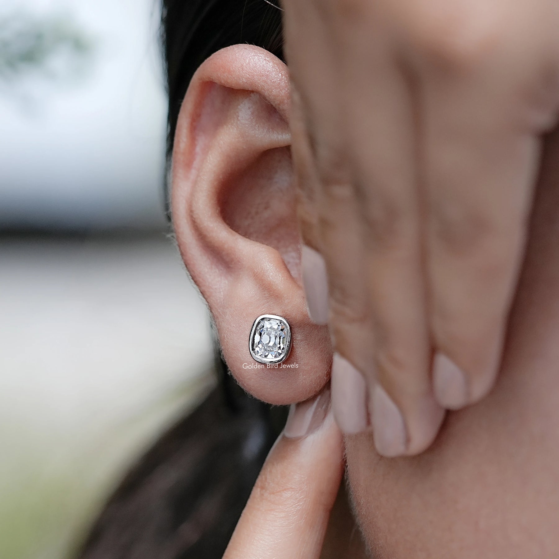 Detailed view of  Old Mine Cushion Stud Earrings in Ear