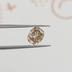 In Tweezer View Of Old Mine Cushion Cut Loose Moissanite Stone