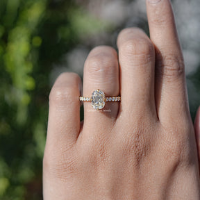In finger view of Old Mine Cushion Moissanite Solitaire Ring