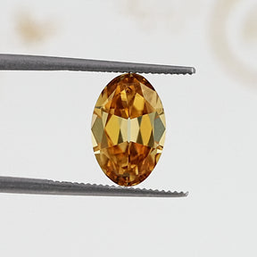 In Tweezer View Of Old Mine Oval Cut Loose Moissanite Stone