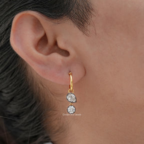 Front view of pear cut moissanite stud earrings in white gold