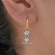 In Ear view of Old Mine Pear And Round Moissanite Dangle Hoop Earrings