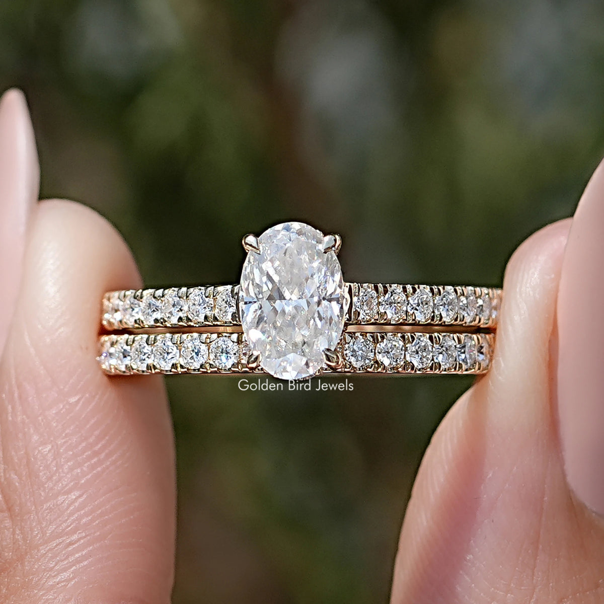 Oval-cut moissanite wedding ring set with pavé bands