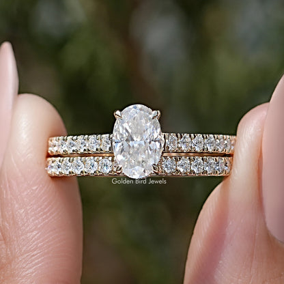 Oval-cut moissanite wedding ring set with pavé bands