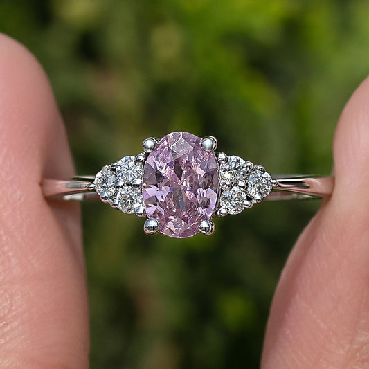 Close-up: sterling silver oval pink tourmaline center with round side stones