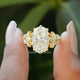 Front View of Oval And Marquise Cut Moissanite Ring In two Fingers