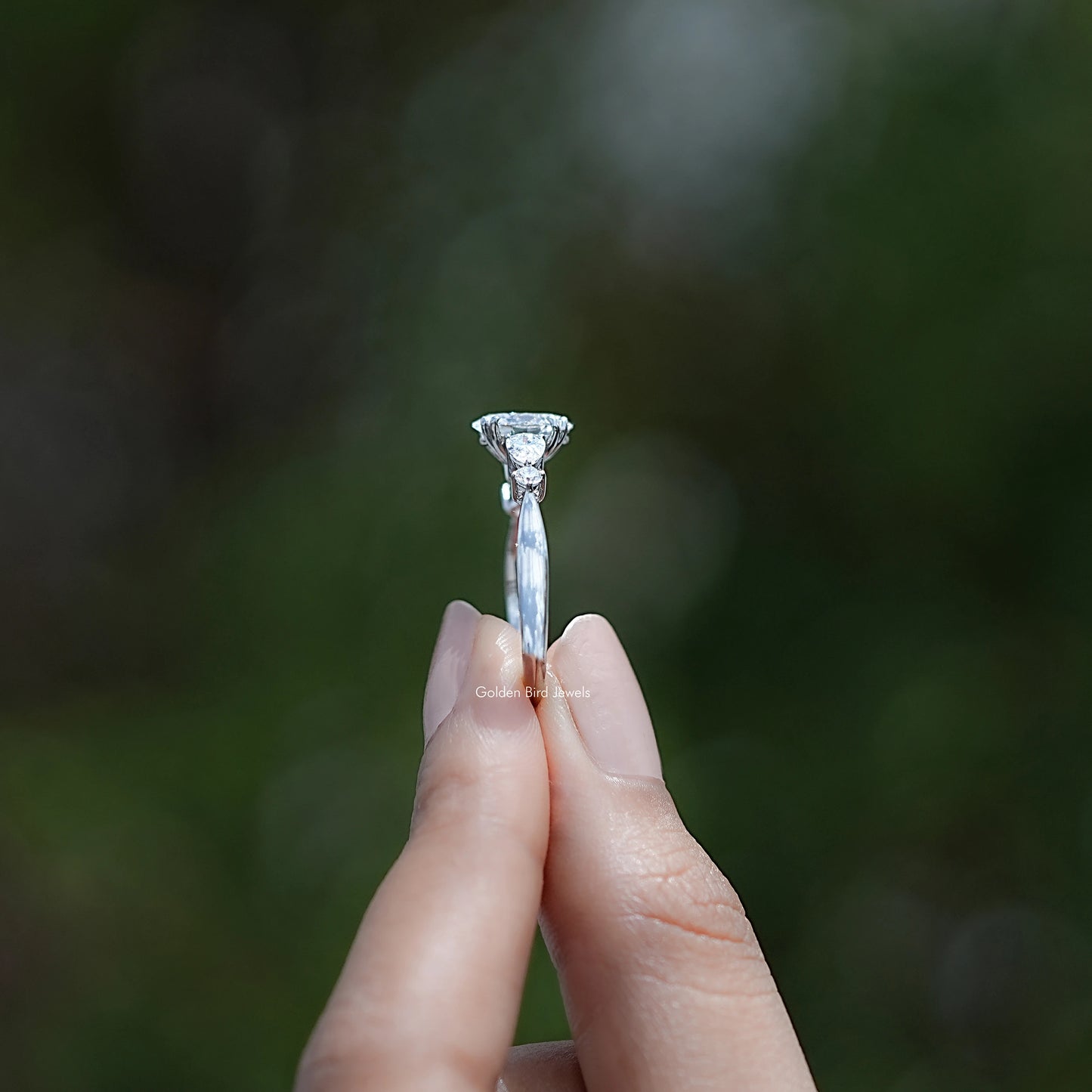 Side View of Oval And Pear Diamond Five Stone Engagement Ring