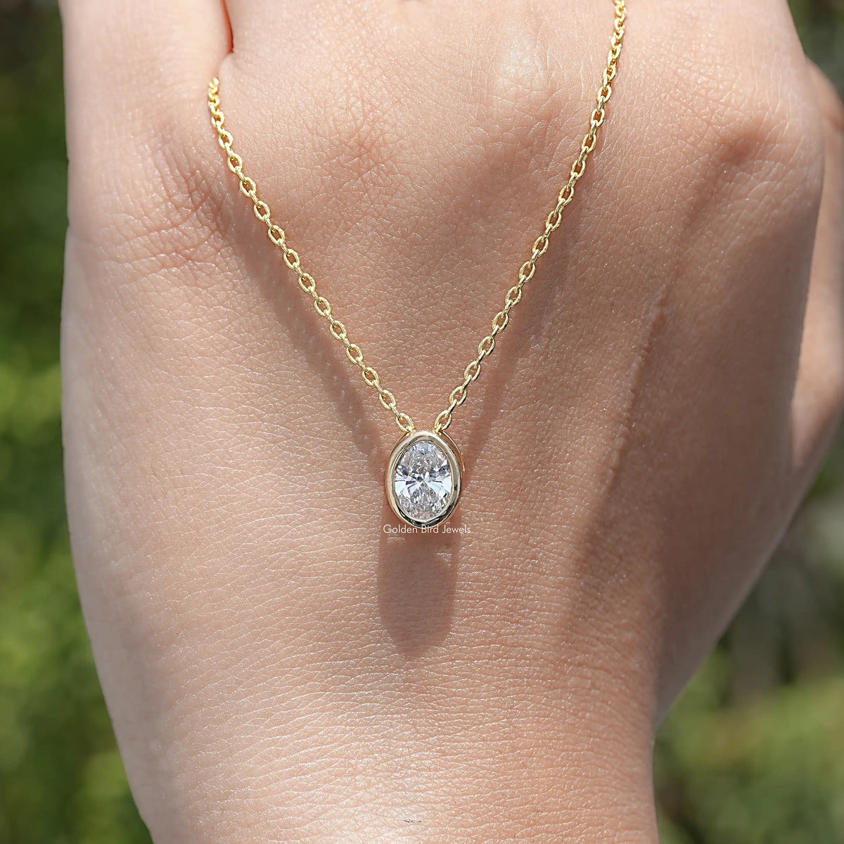 hand Showing View of Oval Cut Lab Diamond Pendant