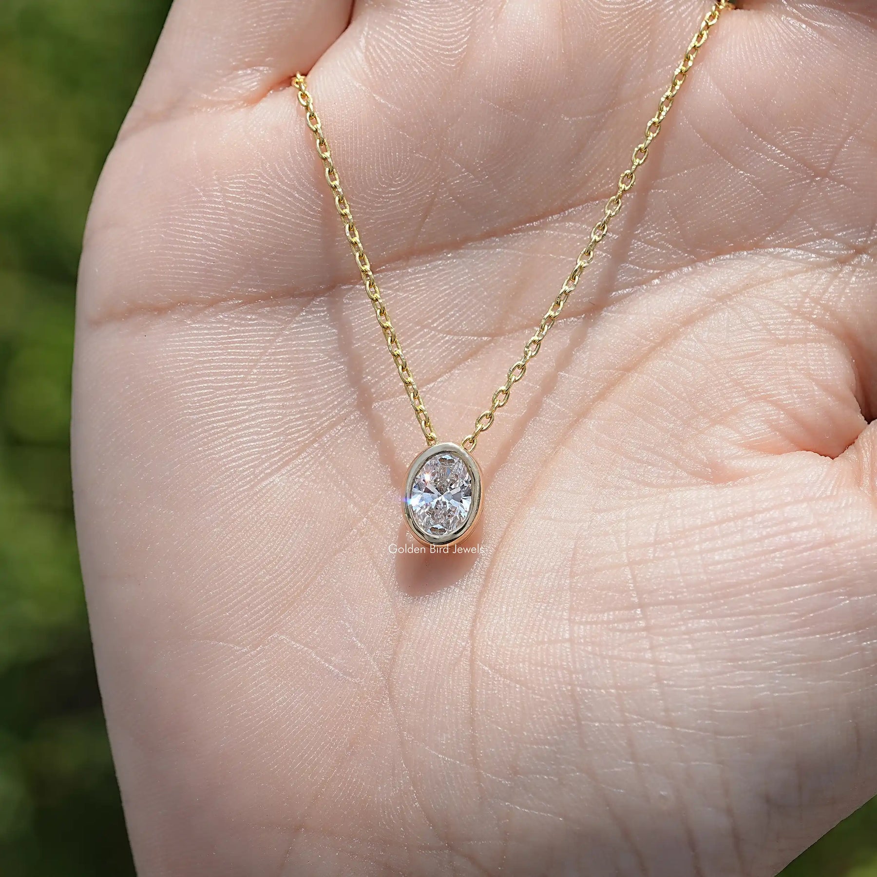 Top View of Oval Cut Bezel Set Solitaire Pendant