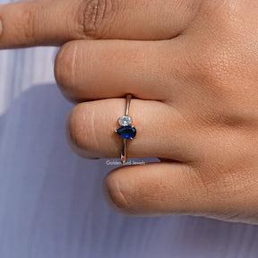 Close View Of Blue Pear Cut Halo Engagement Ring
