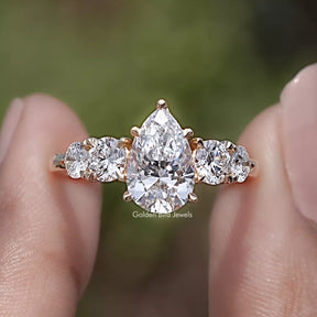 Pear Cut Lab Grown Diamond Five Stone Ring in Two Fingers