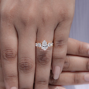 Top view of Pear Cut Diamond Five Stone Ring held in finger
